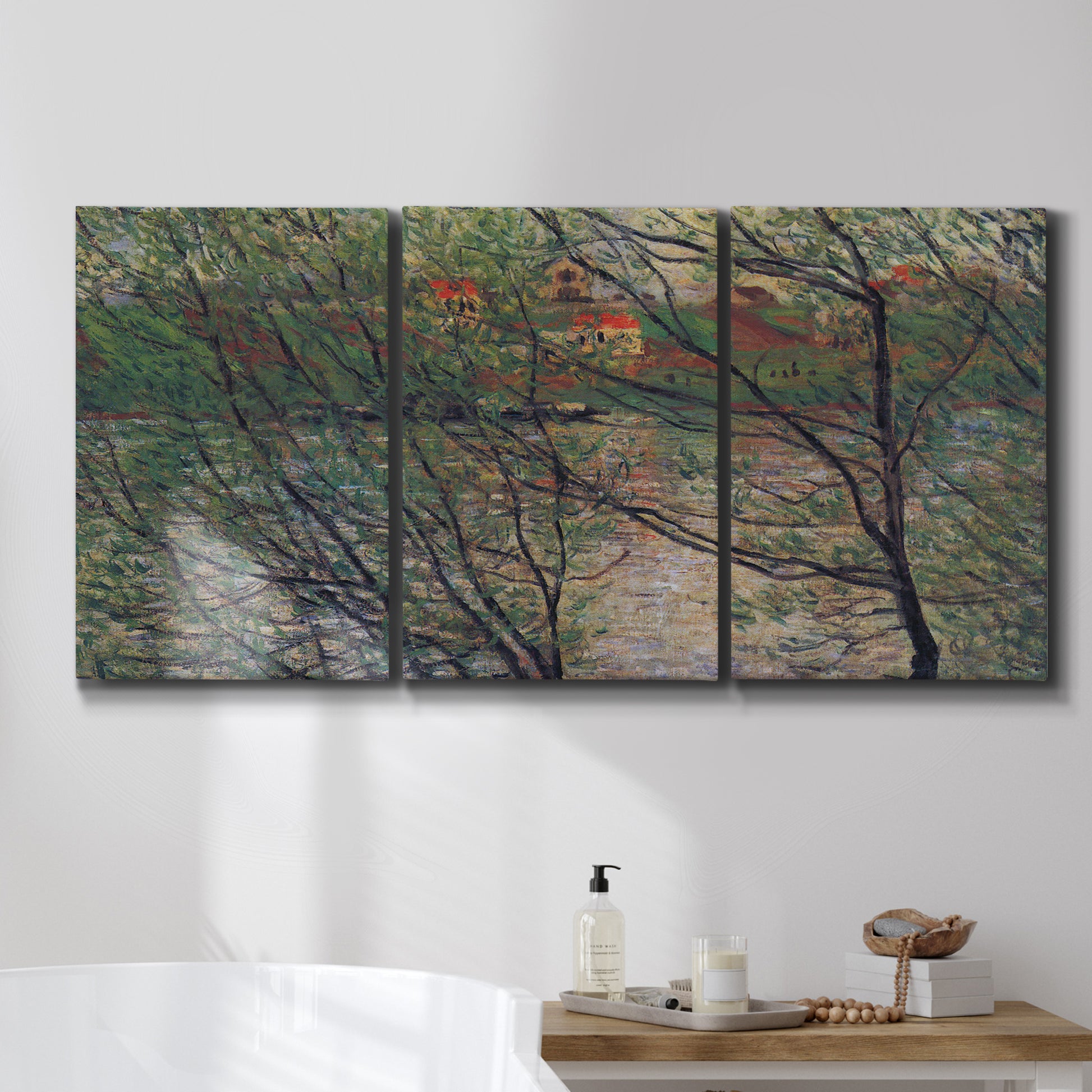 Three-panel canvas wall art featuring spring countryside with fresh foliage, displayed in a bathroom above a bathtub.