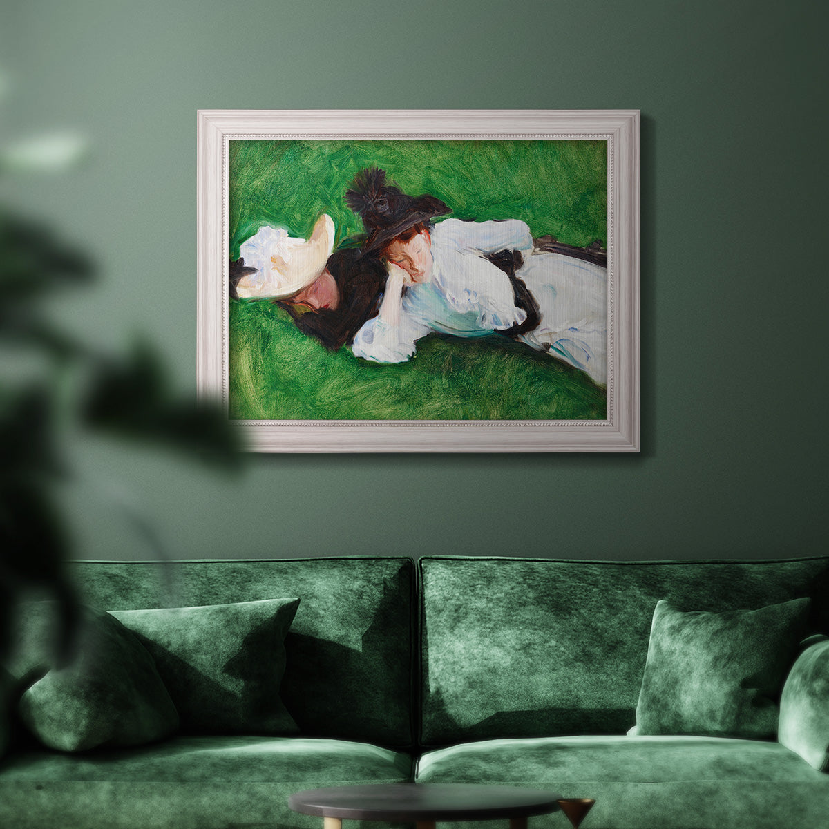 Impressionist outdoor portrait of two girls by John Singer Sargent in an ornate weathered white frame displayed in a dark-toned interior setting.