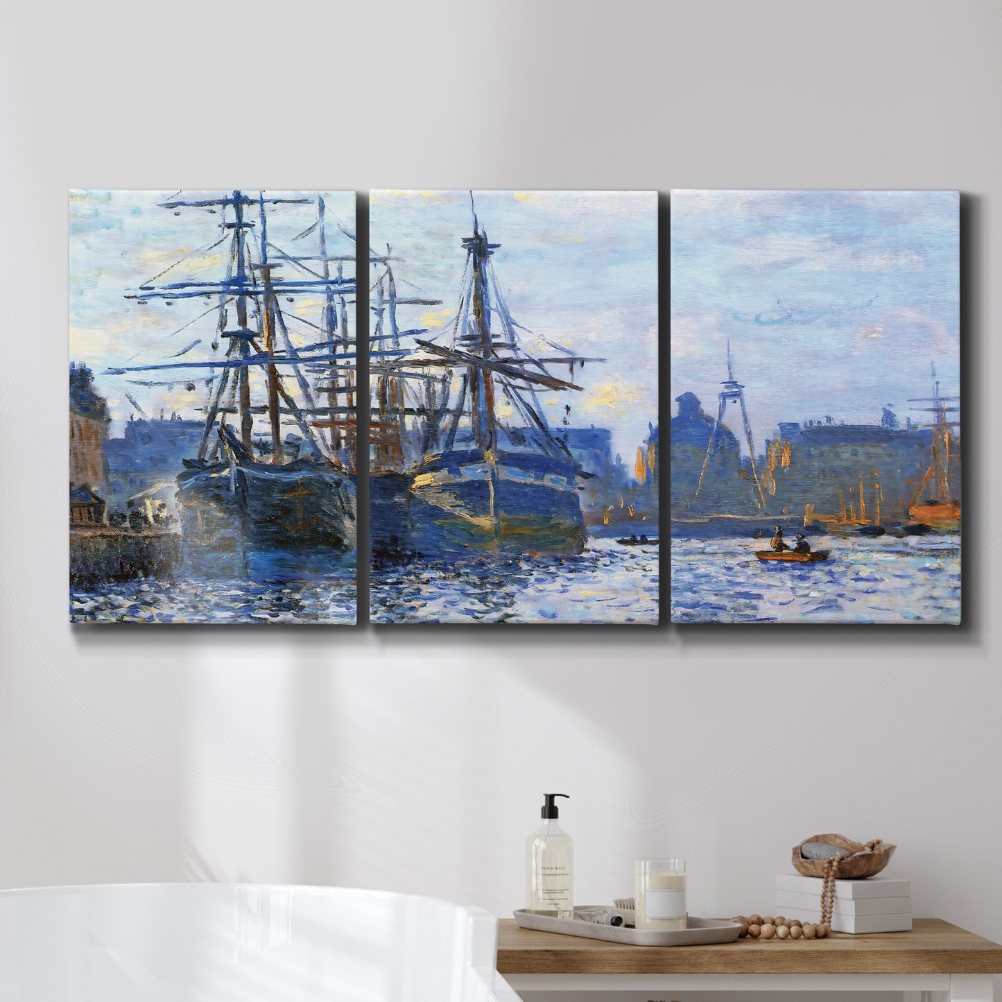 Three-panel canvas wall art featuring industrial dock along harbor, displayed in a bathroom above a bathtub.