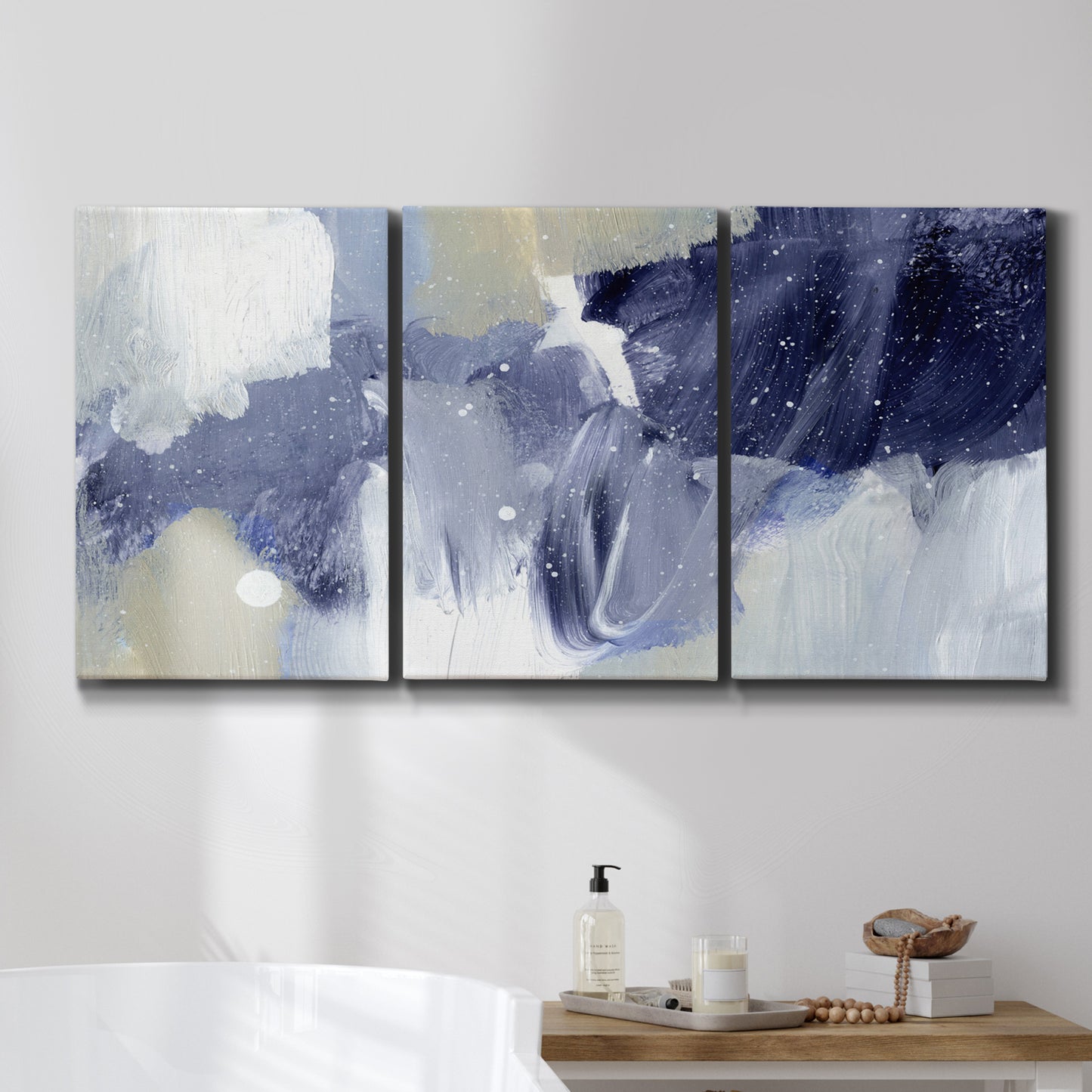 Three-panel canvas wall art featuring abstract sky break composition, displayed in a bathroom above a bathtub.