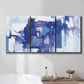 Three-panel canvas wall art featuring abstract urban street scene, displayed in a bathroom above a bathtub.
