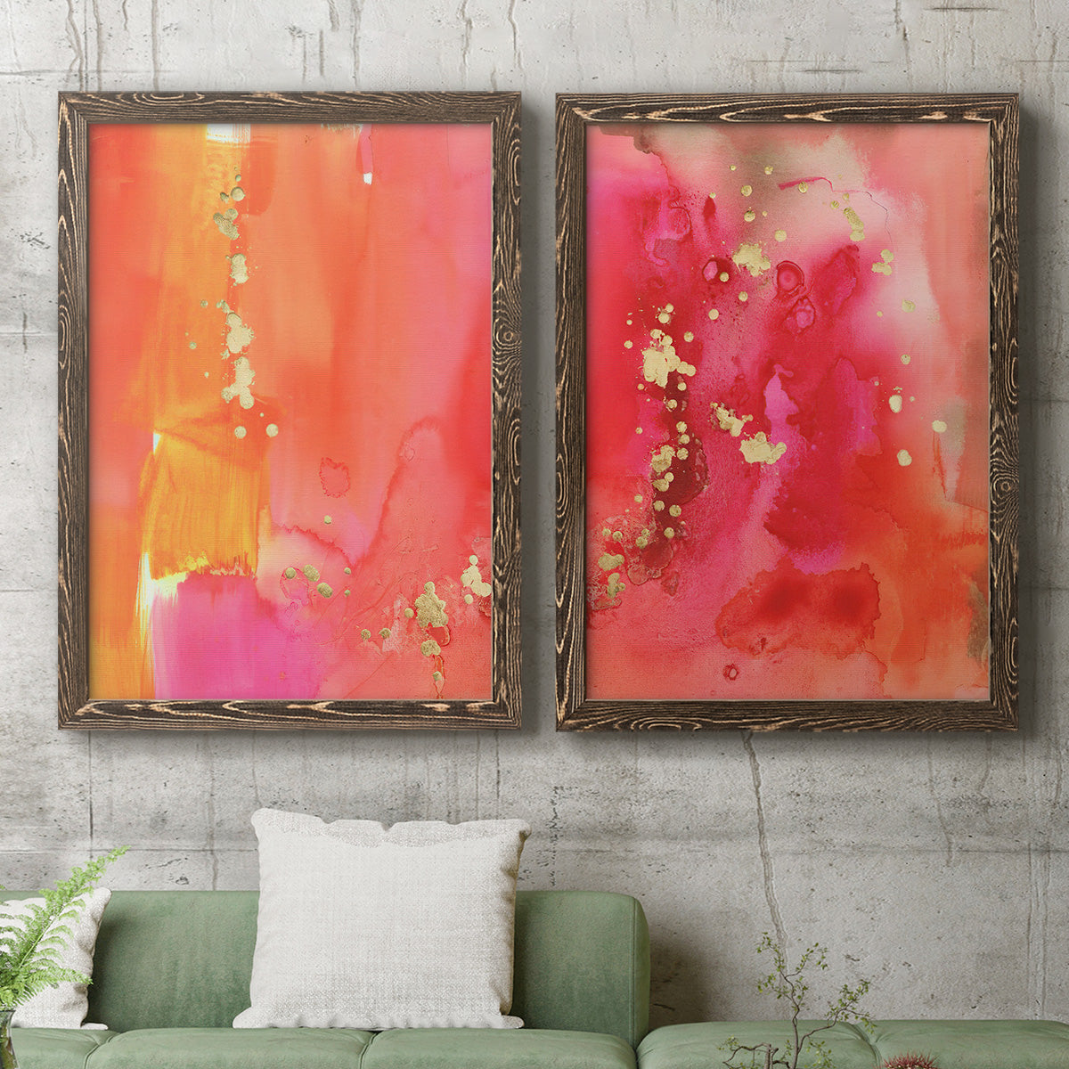 Set of two walnut barnwood framed canvas prints depicting a coordinated art pair of luminous coral orange and pink color fields with gold flecks rendered as glamorous fluid abstracts above a sofa in a modern living room.