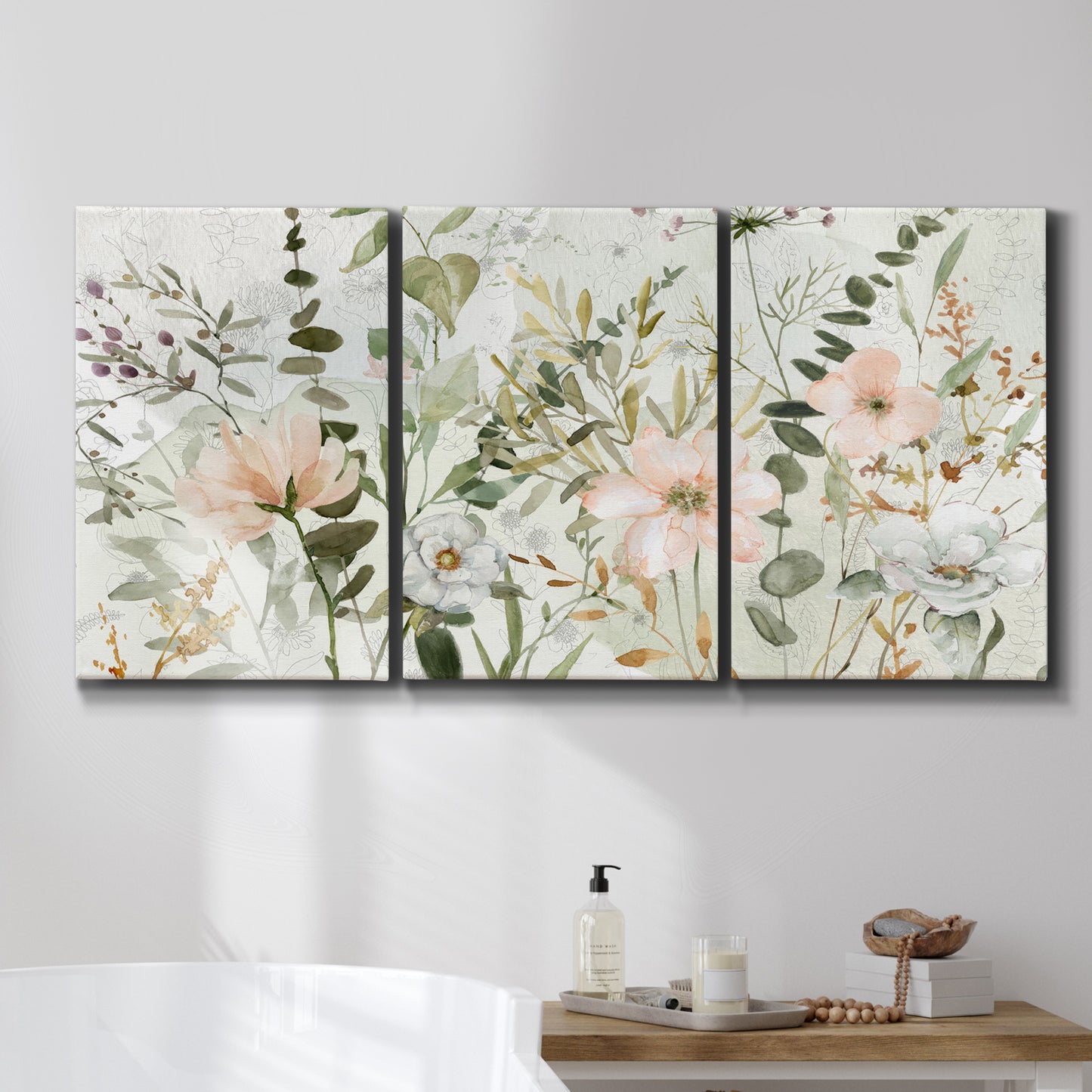 Three-panel canvas wall art featuring vintage floral botanical sketchbook, displayed in a bathroom above a bathtub.
