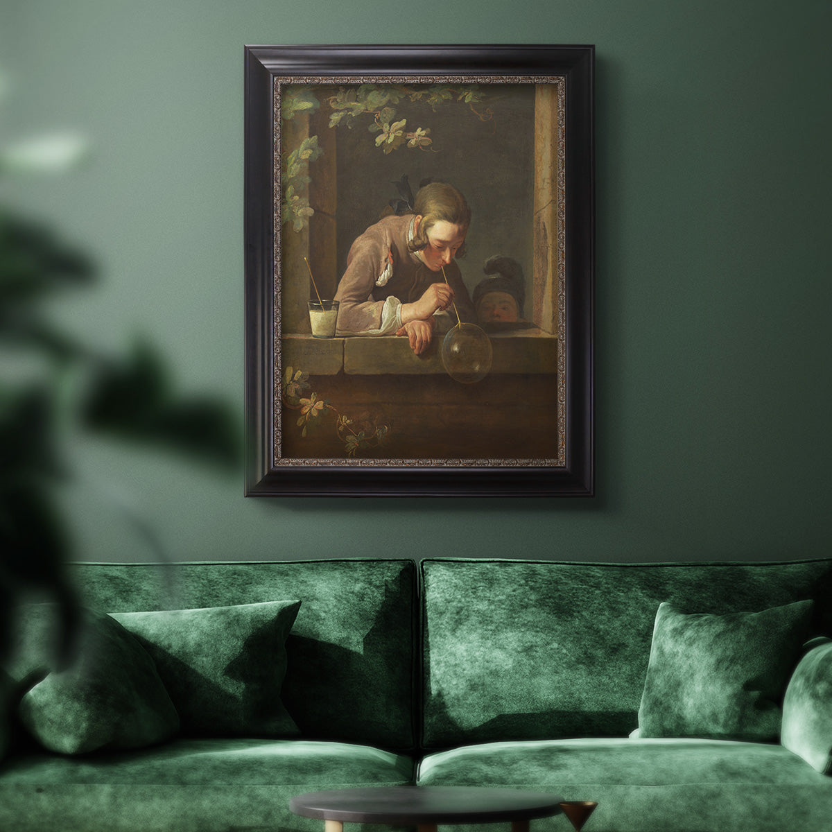 Classical genre painting of a child blowing soap bubbles by Jean-Siméon Chardin in an ornate black frame with gilded inner detail displayed in a dark-toned interior setting.