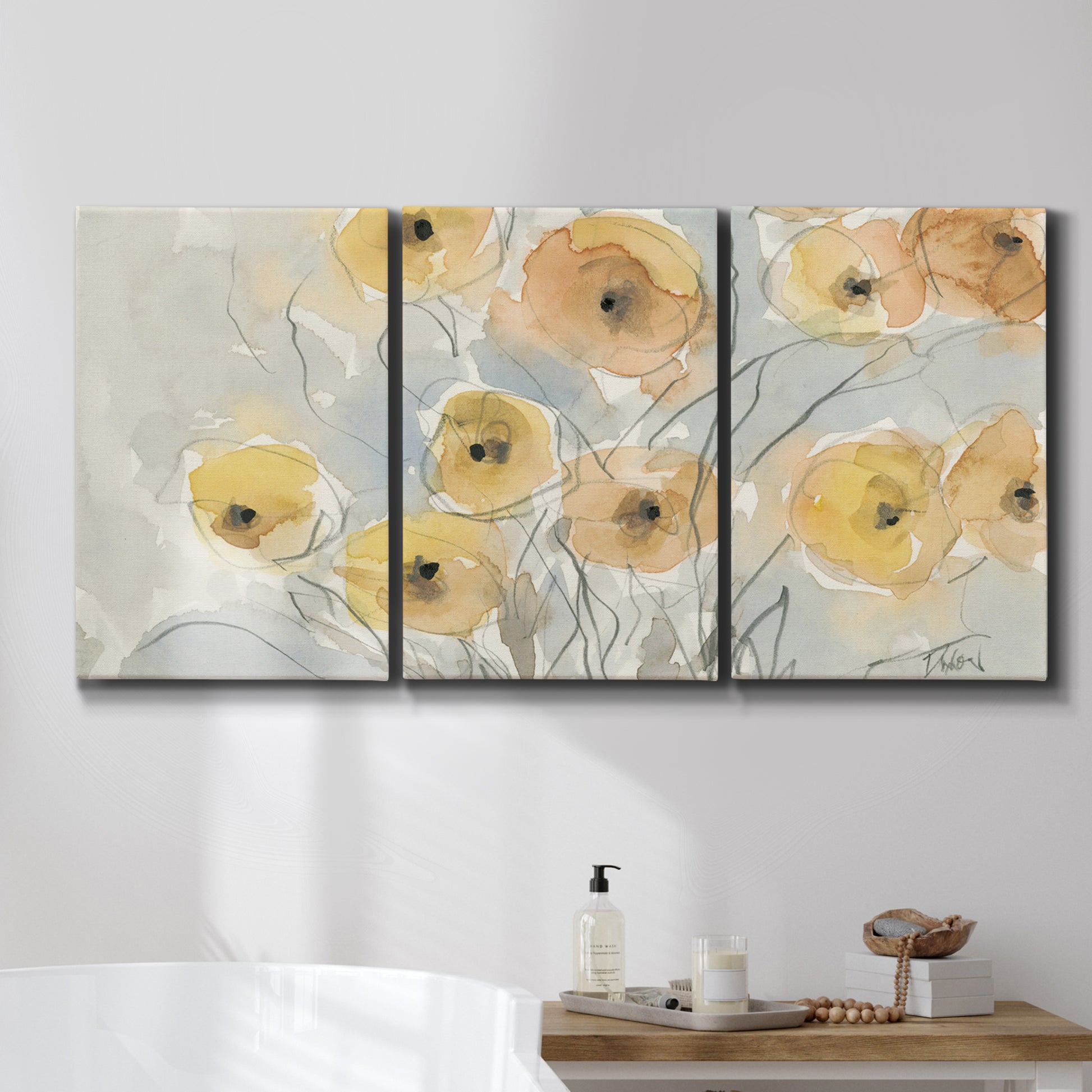 Three-panel canvas wall art featuring minimalist poppies at sunset, displayed in a bathroom above a bathtub.
