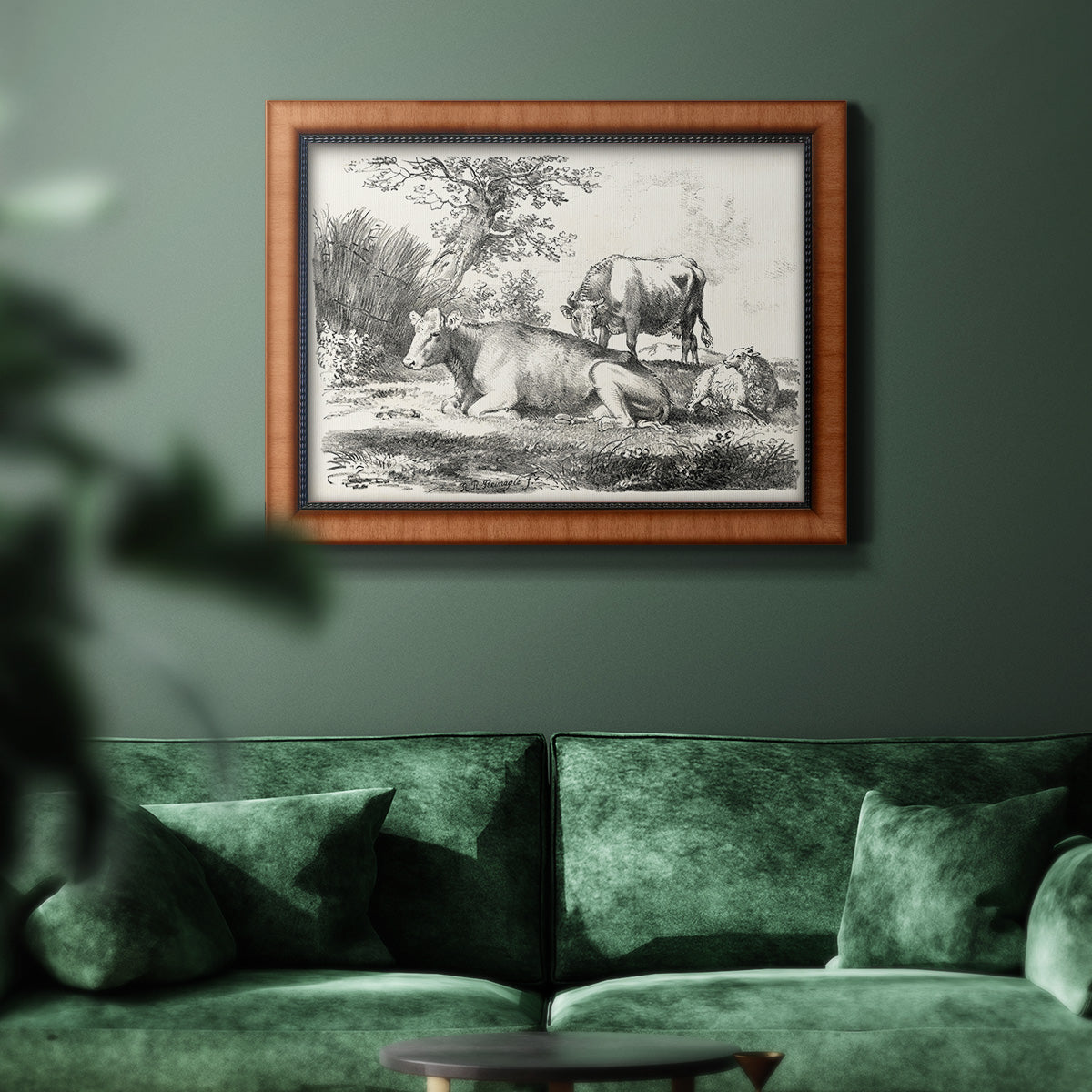 Classical pastoral landscape artwork by Nicolas Berchem in an ornate vintage burl wood frame displayed in a dark-toned interior setting.