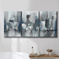 Three-panel canvas wall art featuring urban cityscape rendered in blue tones, displayed in a bathroom above a bathtub.