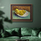Impressionist still life with lemons by Vincent van Gogh in an ornate bronzed mahogany wood frame displayed in a dark-toned interior setting.
