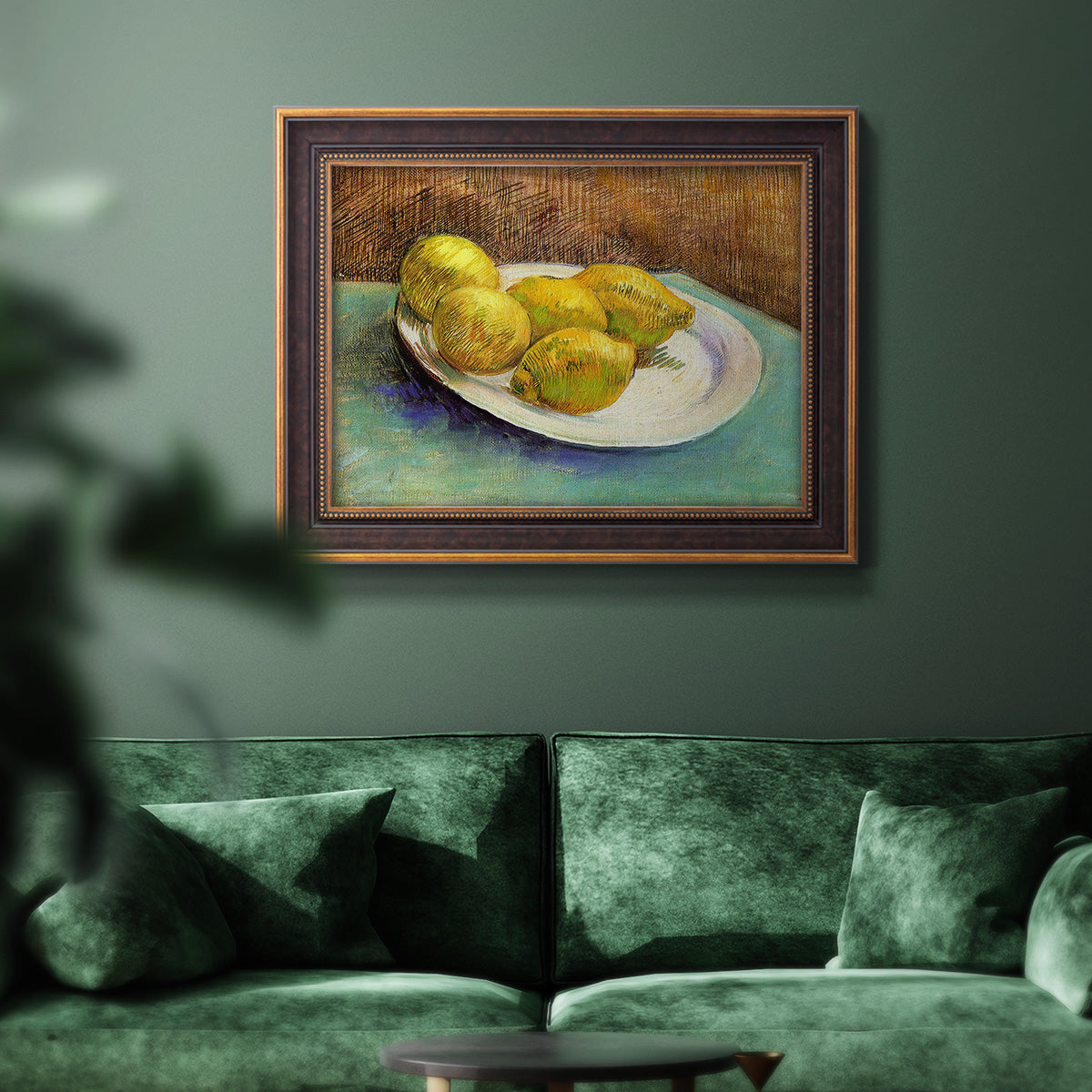 Impressionist still life with lemons by Vincent van Gogh in an ornate bronzed mahogany wood frame displayed in a dark-toned interior setting.
