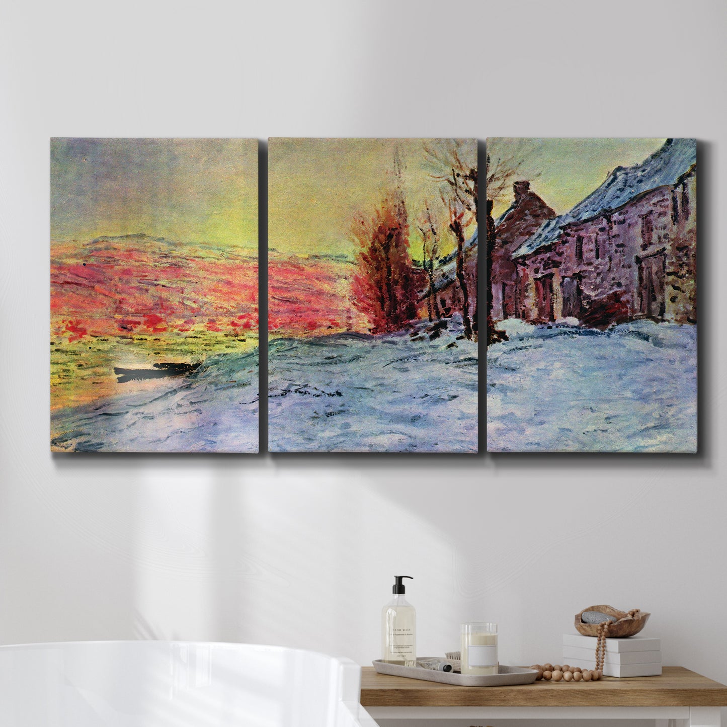 Three-panel canvas wall art featuring river view beneath cloudy sky, displayed in a bathroom above a bathtub.