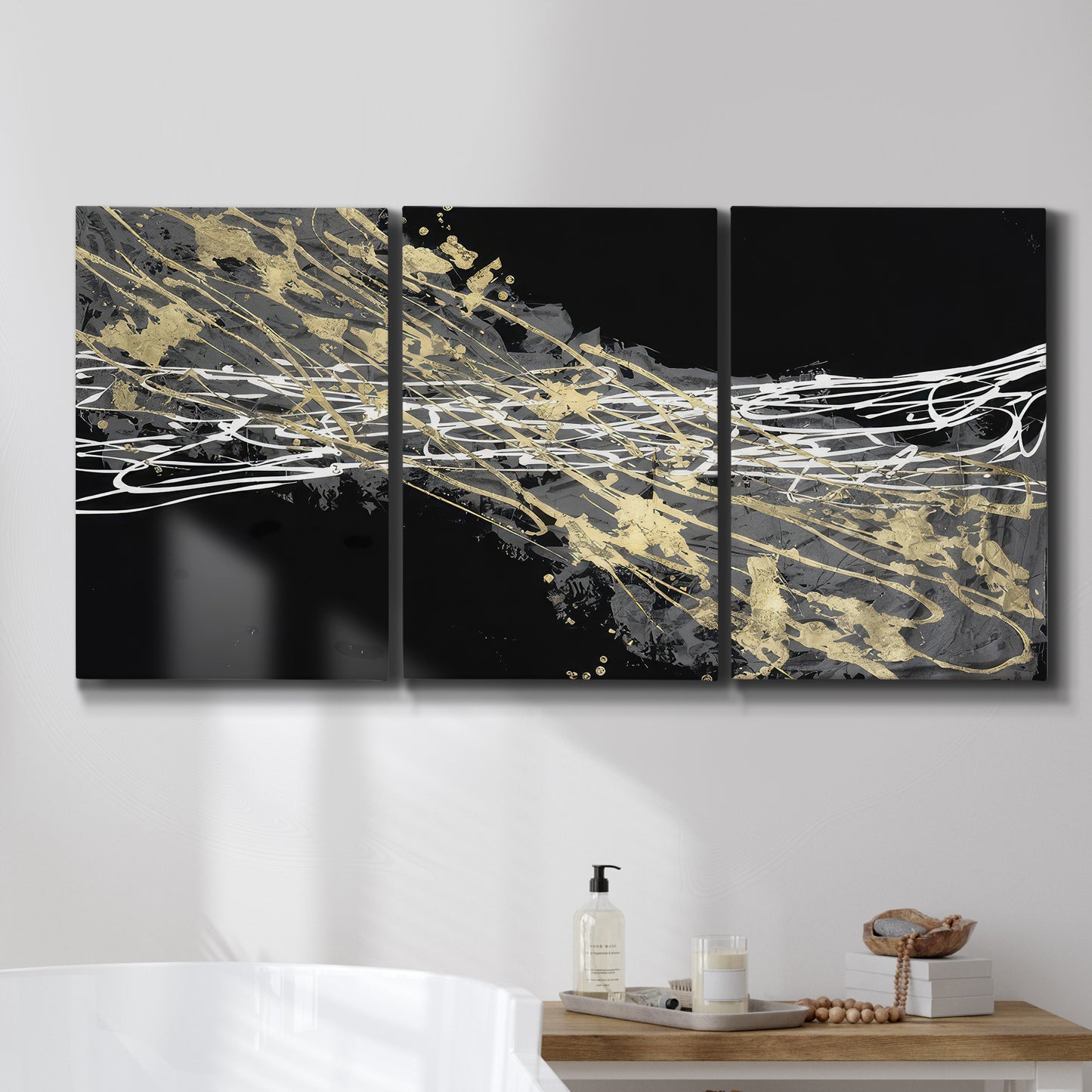 Three-panel canvas wall art featuring dark modern abstract wind patterns, displayed in a bathroom above a bathtub.