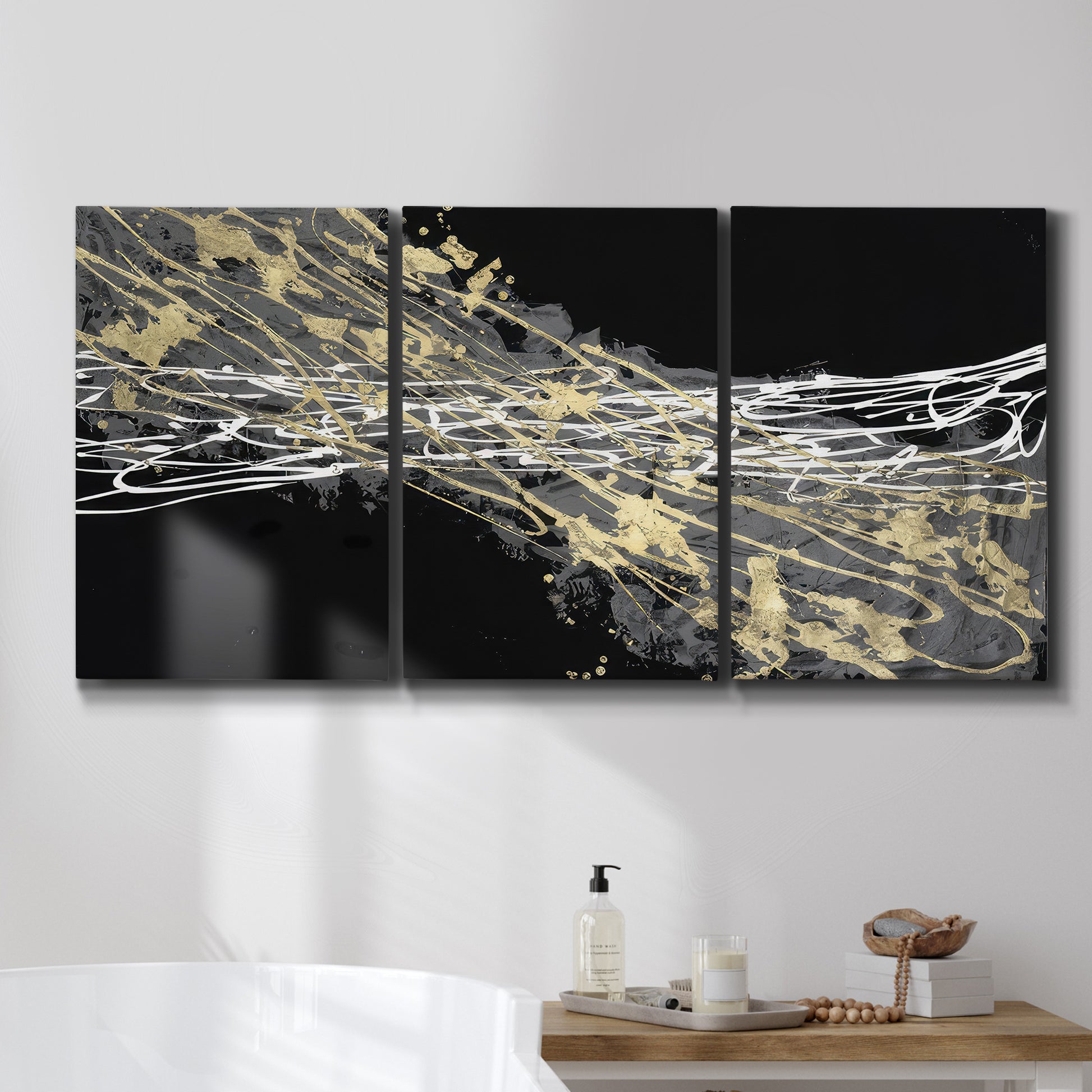 Three-panel canvas wall art featuring dark modern abstract wind patterns, displayed in a bathroom above a bathtub.