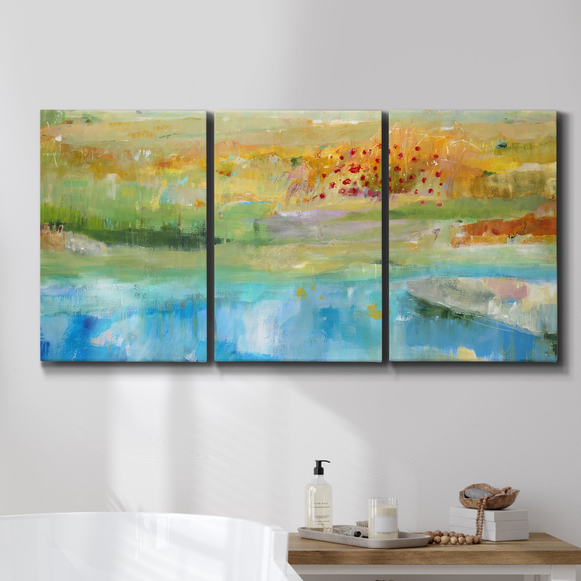 Three-panel canvas wall art featuring abstract sense of forward movement, displayed in a bathroom above a bathtub.