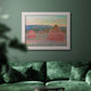 Impressionist haystack series landscape by Claude Monet in an ornate weathered white frame displayed in a dark-toned interior setting.