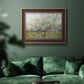Impressionist white-blossomed orchard landscape by Vincent van Gogh in an ornate bronzed mahogany wood frame displayed in a dark-toned interior setting.