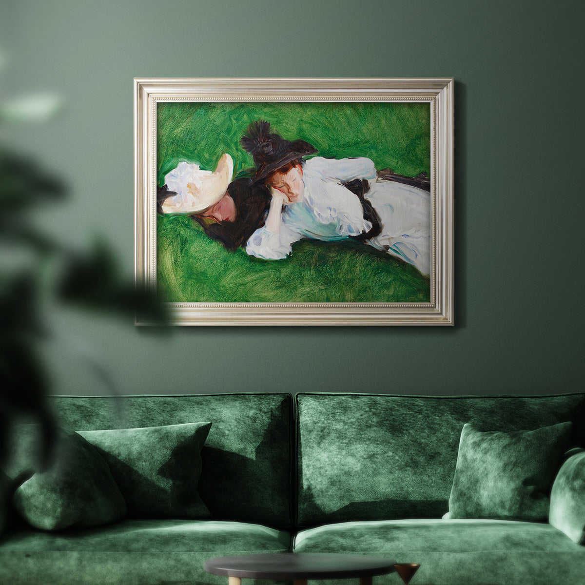 Impressionist outdoor portrait of two girls by John Singer Sargent in an ornate champagne frame displayed in a dark-toned interior setting.
