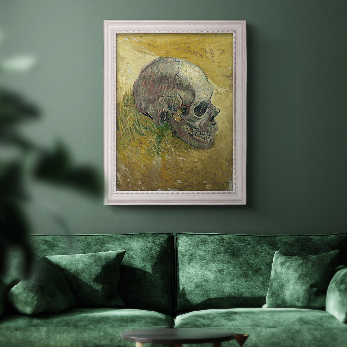 Profile skull study artwork by Vincent van Gogh in an ornate weathered white frame displayed in a dark-toned interior setting.