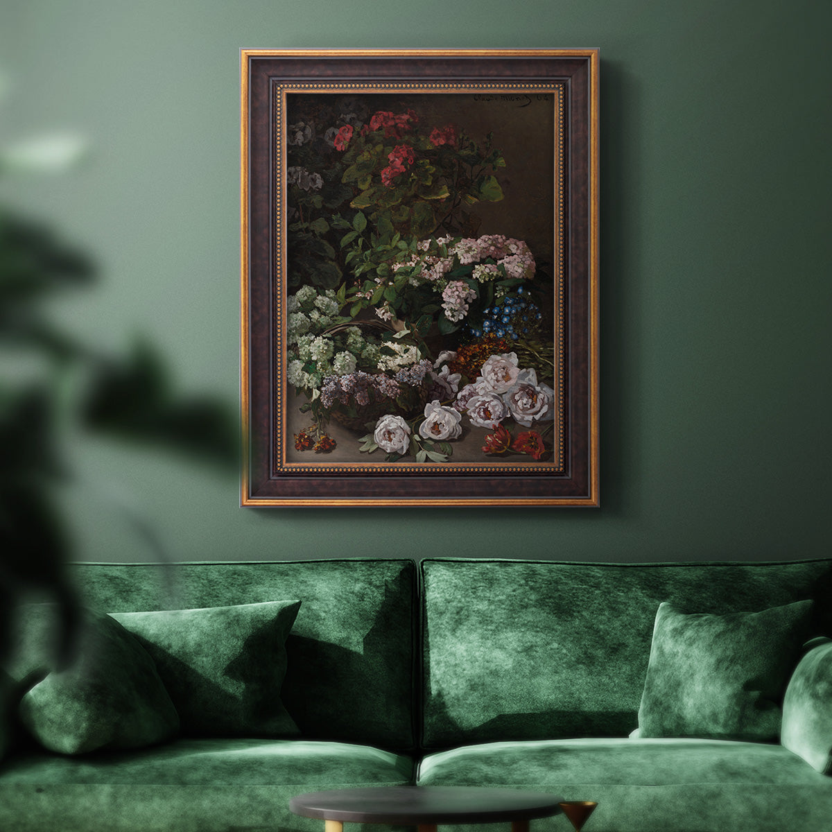 Early impressionist floral painting by Claude Monet in an ornate bronzed mahogany wood frame displayed in a dark-toned interior setting.