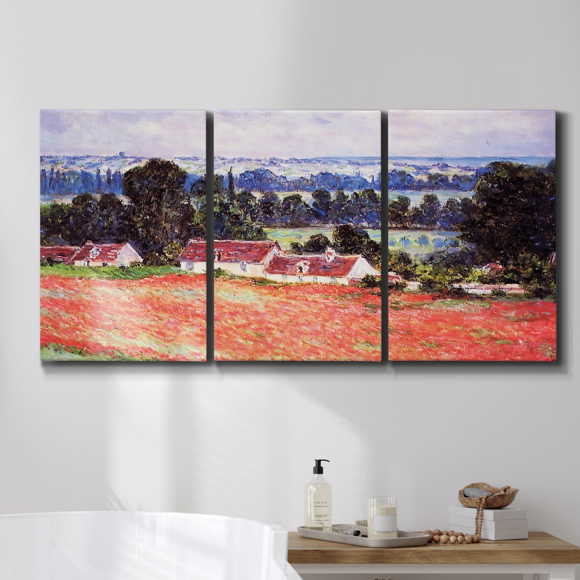 Three-panel canvas wall art featuring poppy field at giverny in bloom, displayed in a bathroom above a bathtub.