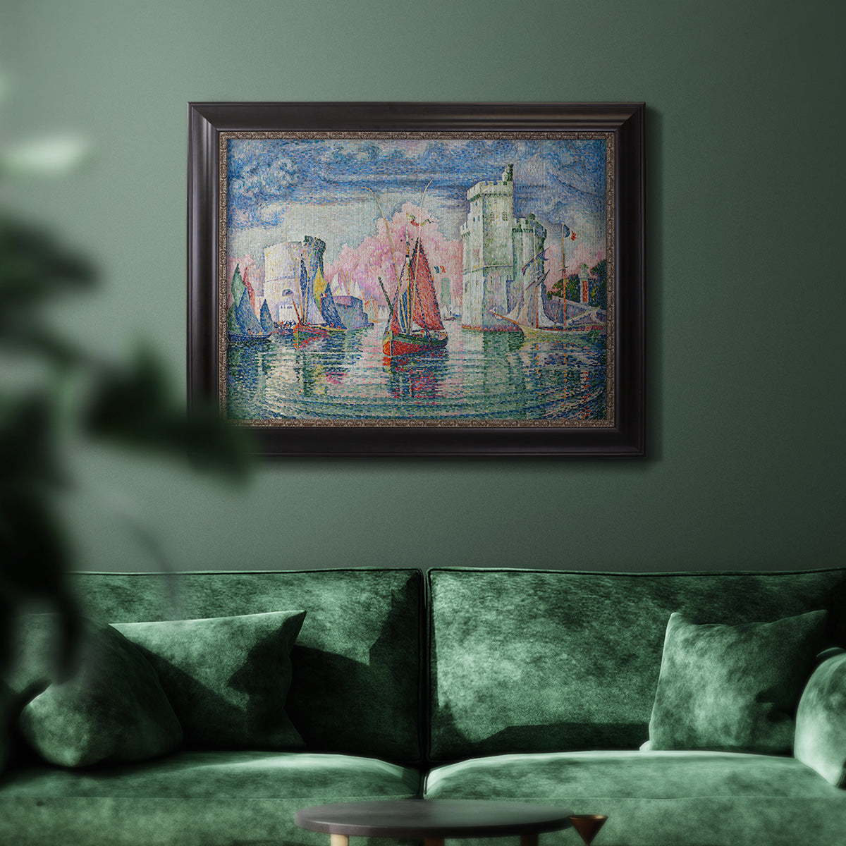 Impressionist harbor scene by Paul Signac in an ornate black frame with gilded inner detail displayed in a dark-toned interior setting.