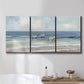 Three-panel canvas wall art featuring shore birds searching along beach, displayed in a bathroom above a bathtub.