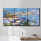 Three-panel canvas wall art featuring water lilies in blue and gold, displayed in a bathroom above a bathtub.