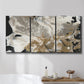 Three-panel canvas wall art featuring pale abstract mask like forms, displayed in a bathroom above a bathtub.