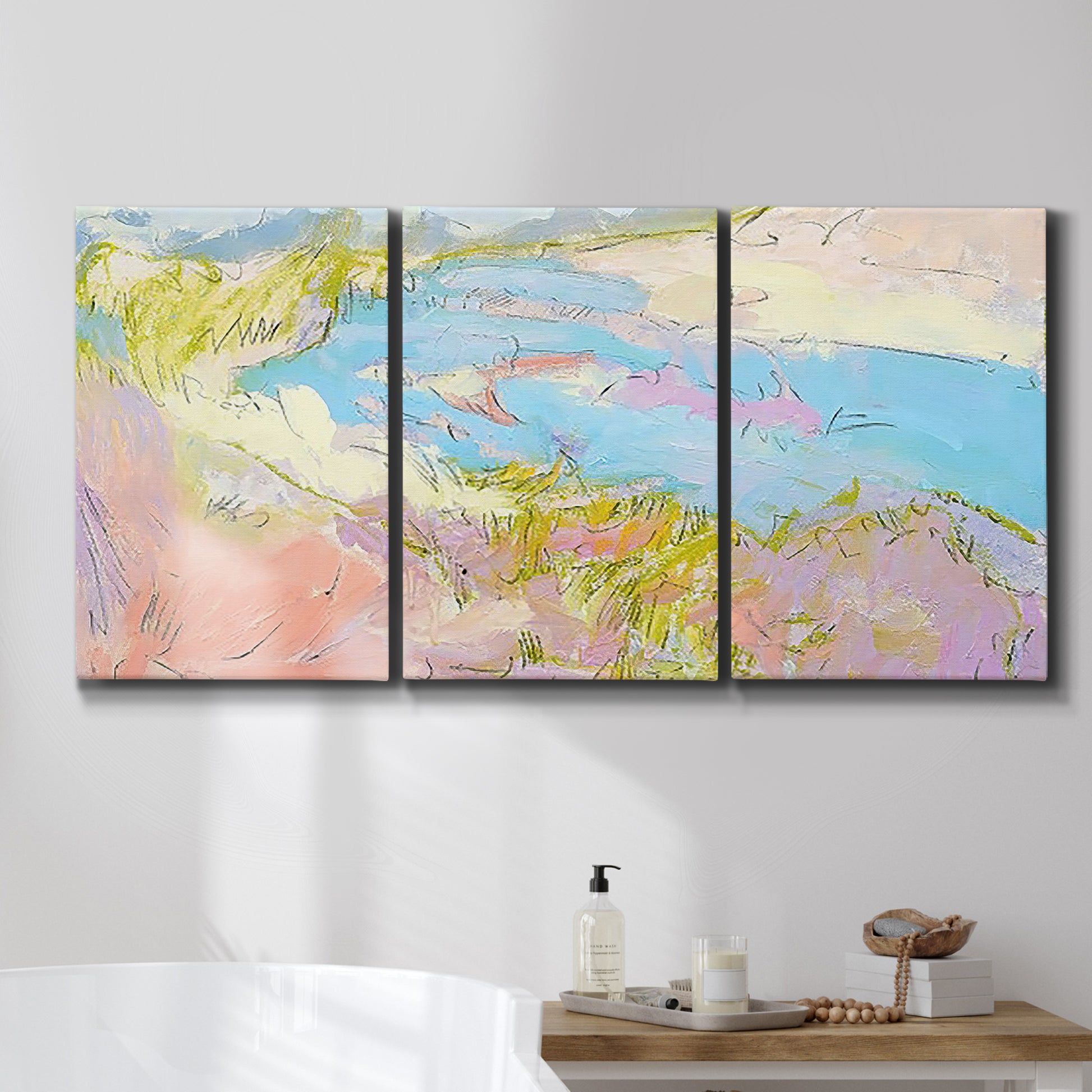 Three-panel canvas wall art featuring geometric mid century abstract blocks, displayed in a bathroom above a bathtub.