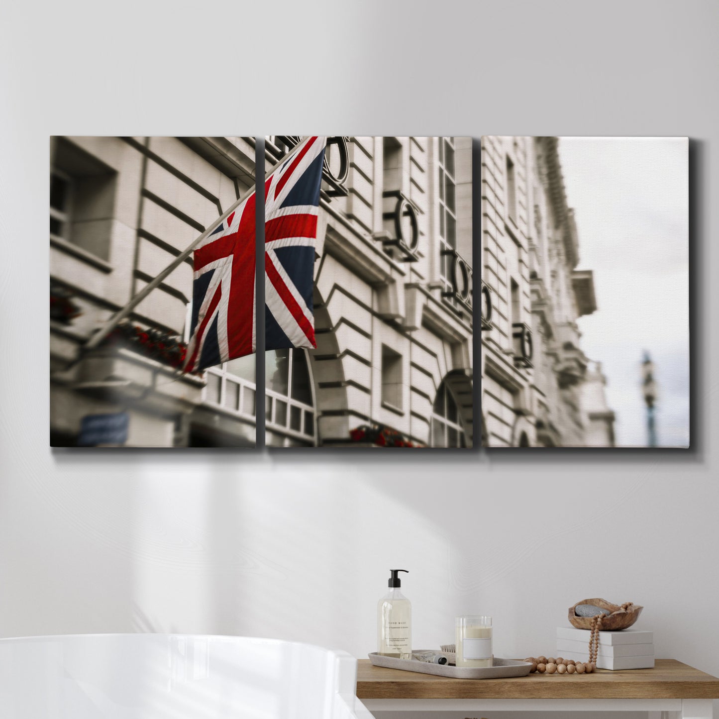 Three-panel canvas wall art featuring london street scene photograph, displayed in a bathroom above a bathtub.