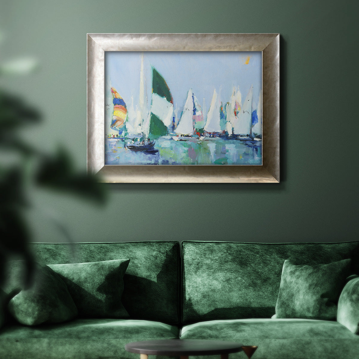 Coastal harbor watercolor painting in an ornate mottled silver frame displayed in a dark-toned interior setting.