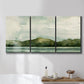 Three-panel canvas wall art featuring riverbank watercolor landscape, displayed in a bathroom above a bathtub.