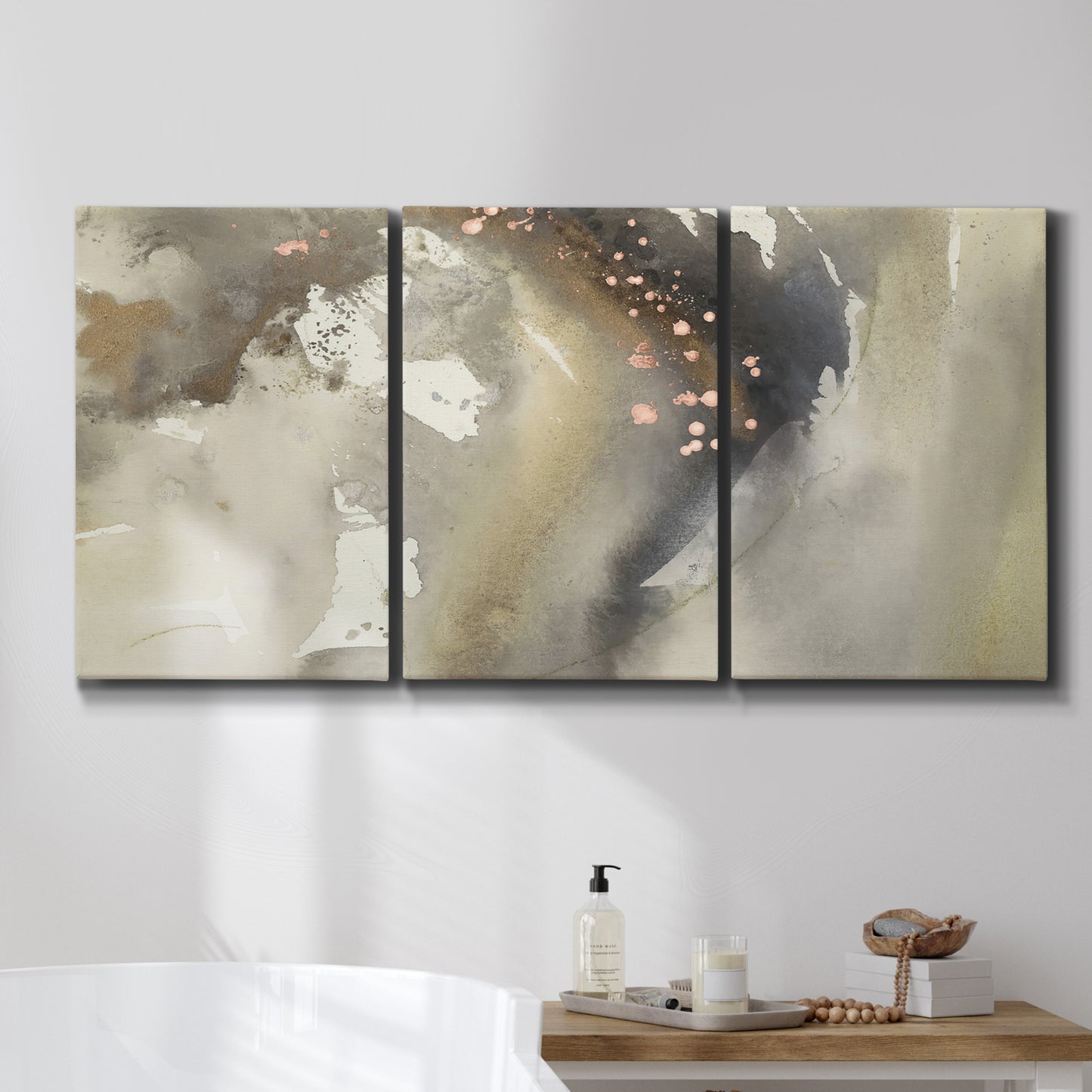 Three-panel canvas wall art featuring flowing abstract wave motion, displayed in a bathroom above a bathtub.
