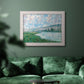 Impressionist river landscape at Vétheuil by Claude Monet in an ornate weathered white frame displayed in a dark-toned interior setting.