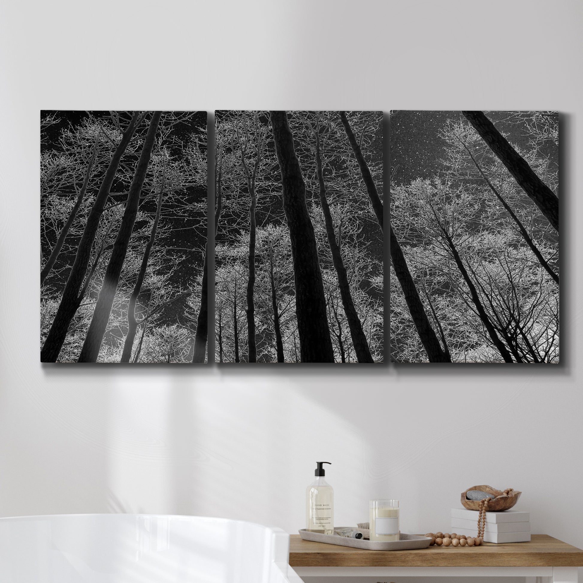 Three-panel canvas wall art featuring riverside houses along canal, displayed in a bathroom above a bathtub.