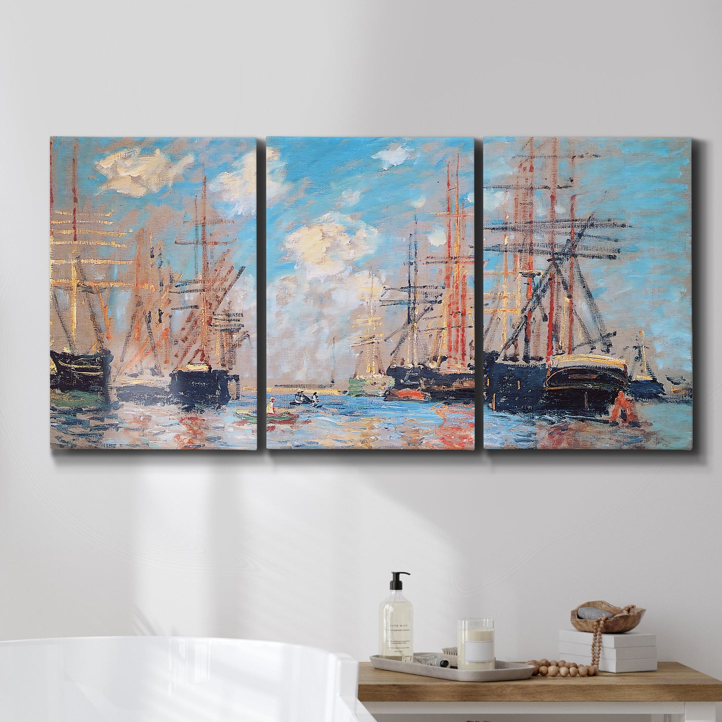 Three-panel canvas wall art featuring harbor with boats and water, displayed in a bathroom above a bathtub.