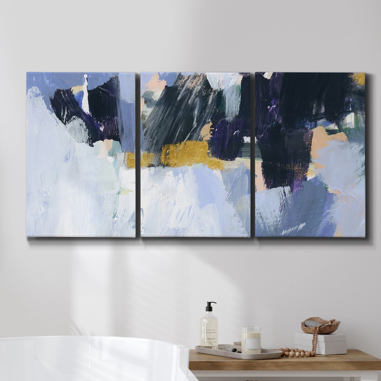 Three-panel canvas wall art featuring icy abstract arctic ledge, displayed in a bathroom above a bathtub.