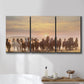 Three-panel canvas wall art featuring running horses captured in motion, displayed in a bathroom above a bathtub.