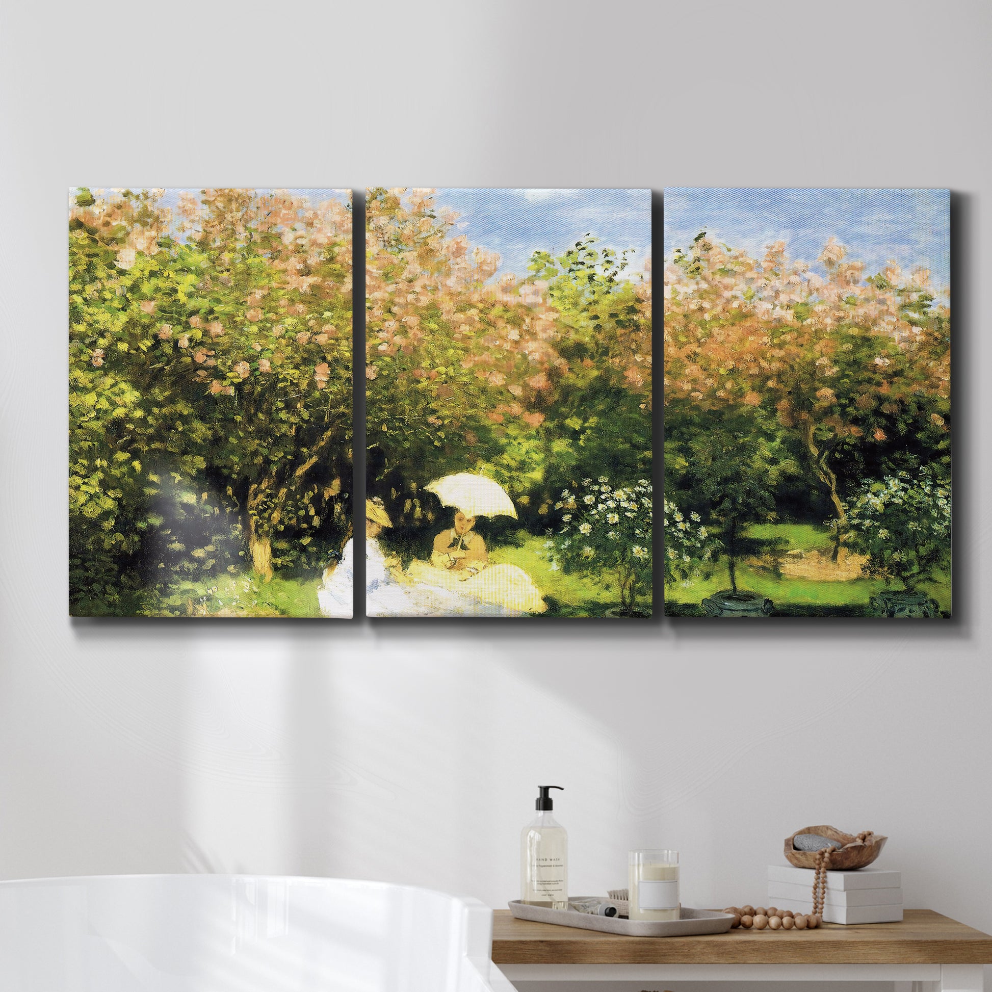 Three-panel canvas wall art featuring lush garden landscape with trees, displayed in a bathroom above a bathtub.