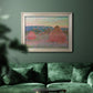 Impressionist haystack series landscape by Claude Monet in an ornate champagne frame displayed in a dark-toned interior setting.