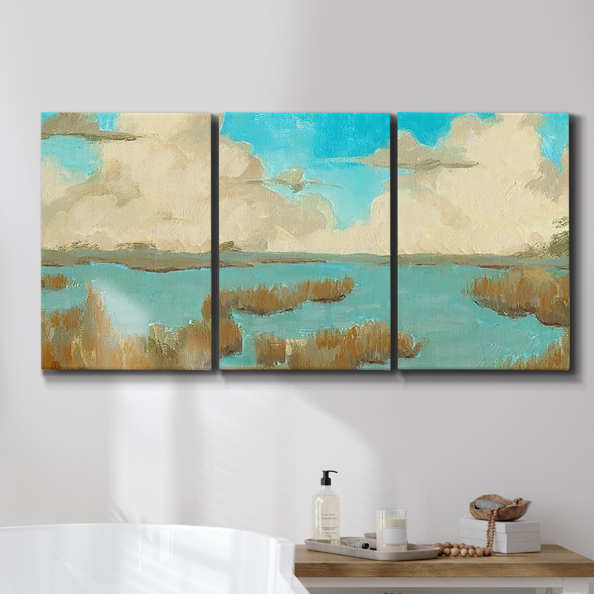 Three-panel canvas wall art featuring abstract pond scene with reflections, displayed in a bathroom above a bathtub.