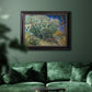 Impressionist lilac flower painting by Vincent van Gogh in an ornate black frame with gilded inner detail displayed in a dark-toned interior setting.