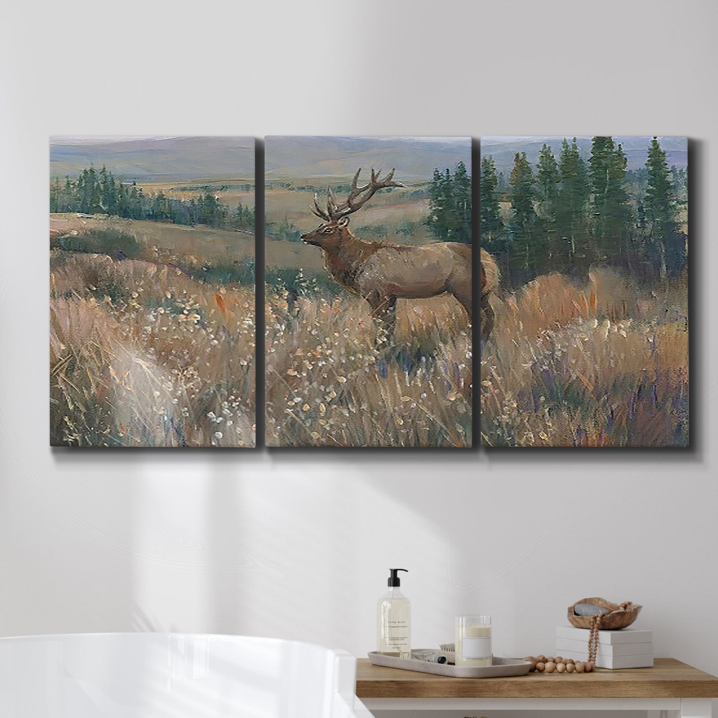 Three-panel canvas wall art featuring western wildlife standing in grassland, displayed in a bathroom above a bathtub.