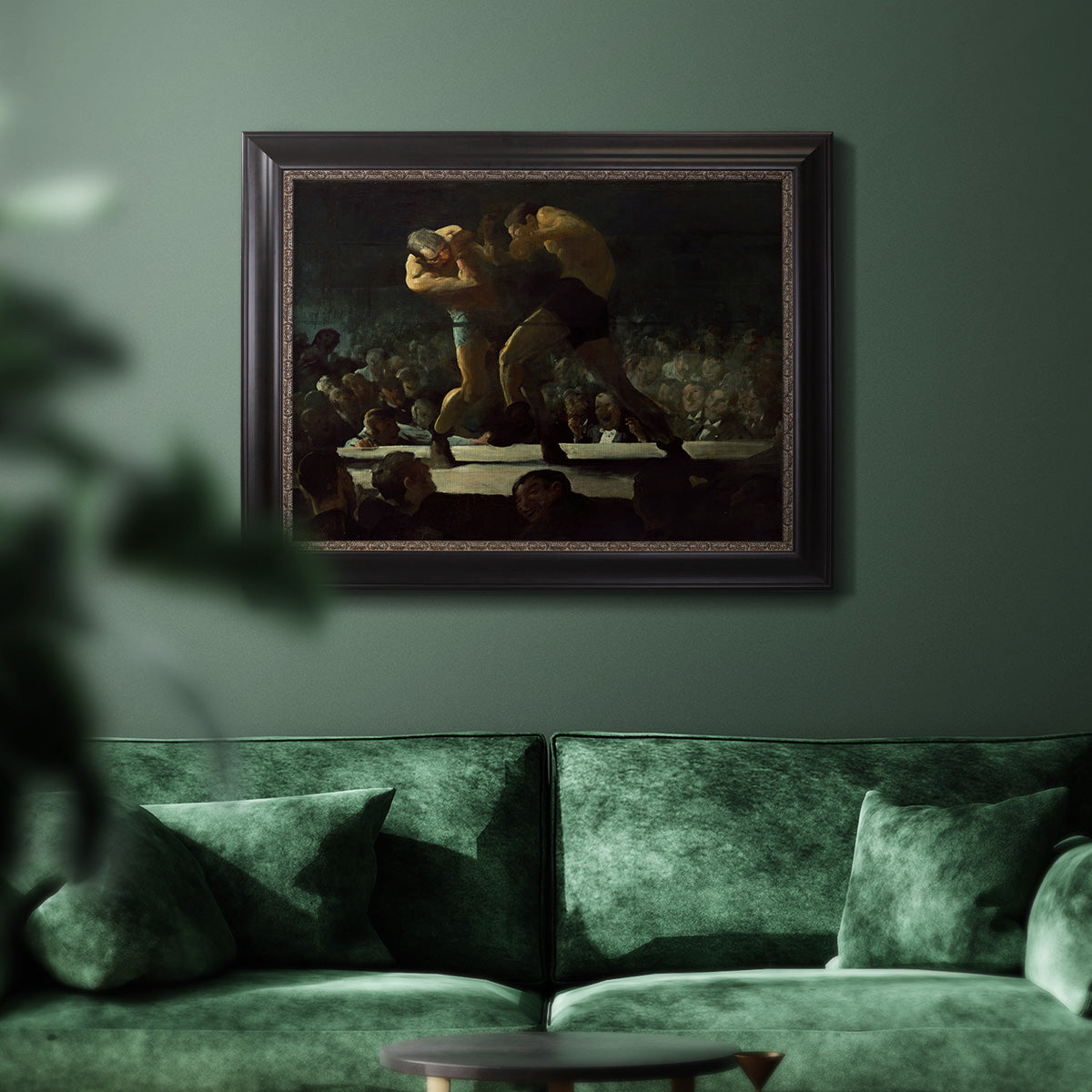 American social club scene painting by George Bellows in an ornate black frame with gilded inner detail displayed in a dark-toned interior setting.
