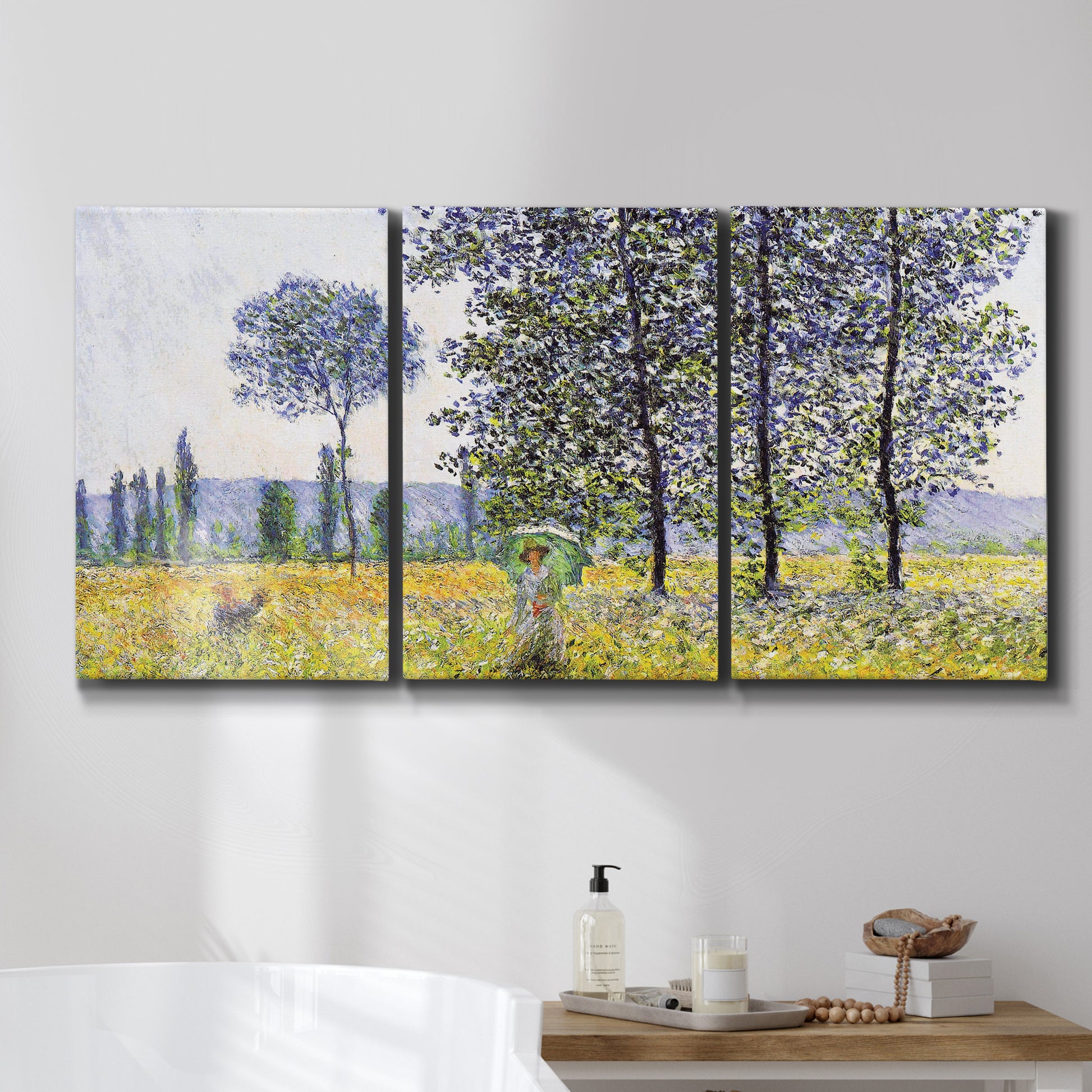 Three-panel canvas wall art featuring sunlight filtering through tall poplars, displayed in a bathroom above a bathtub.