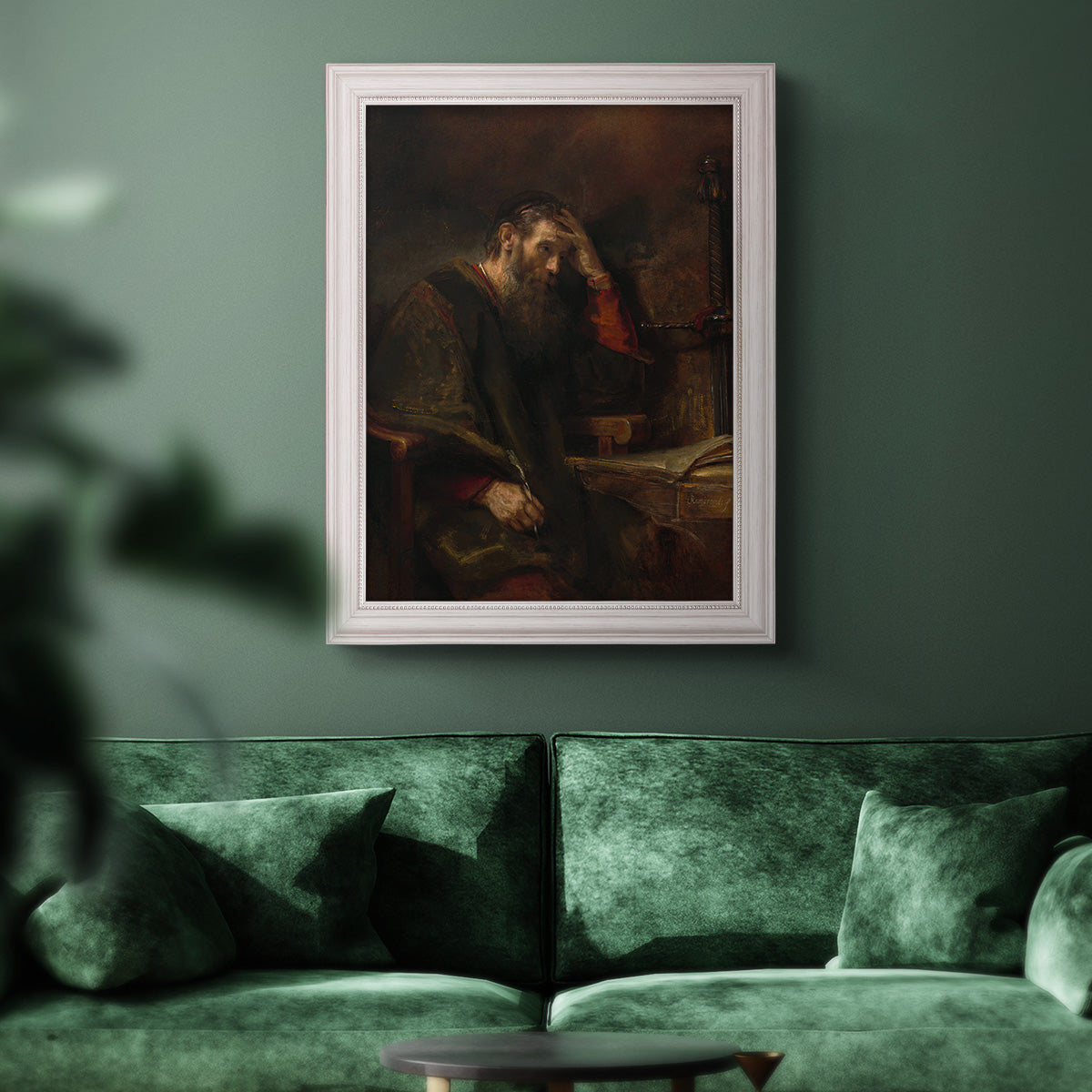 Classical religious portrait of Paul the Apostle by Rembrandt van Rijn in an ornate weathered white frame displayed in a dark-toned interior setting.