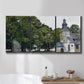 Three-panel canvas wall art featuring chapel building in rural setting, displayed in a bathroom above a bathtub.