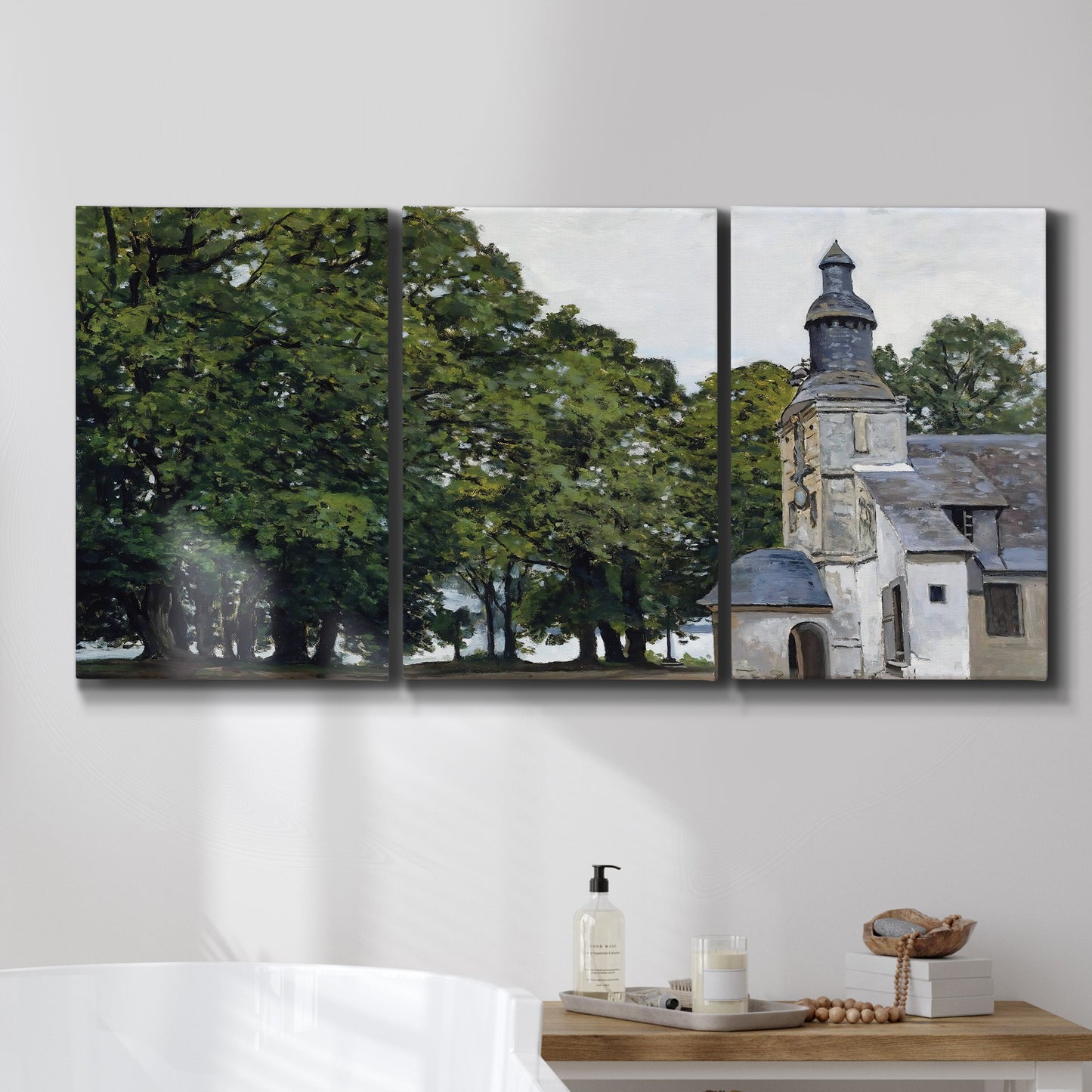 Three-panel canvas wall art featuring chapel building in rural setting, displayed in a bathroom above a bathtub.