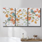 Three-panel canvas wall art featuring decorative bird trio illustration, displayed in a bathroom above a bathtub.