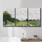 Three-panel canvas wall art featuring spring landscape with blossoming trees, displayed in a bathroom above a bathtub.