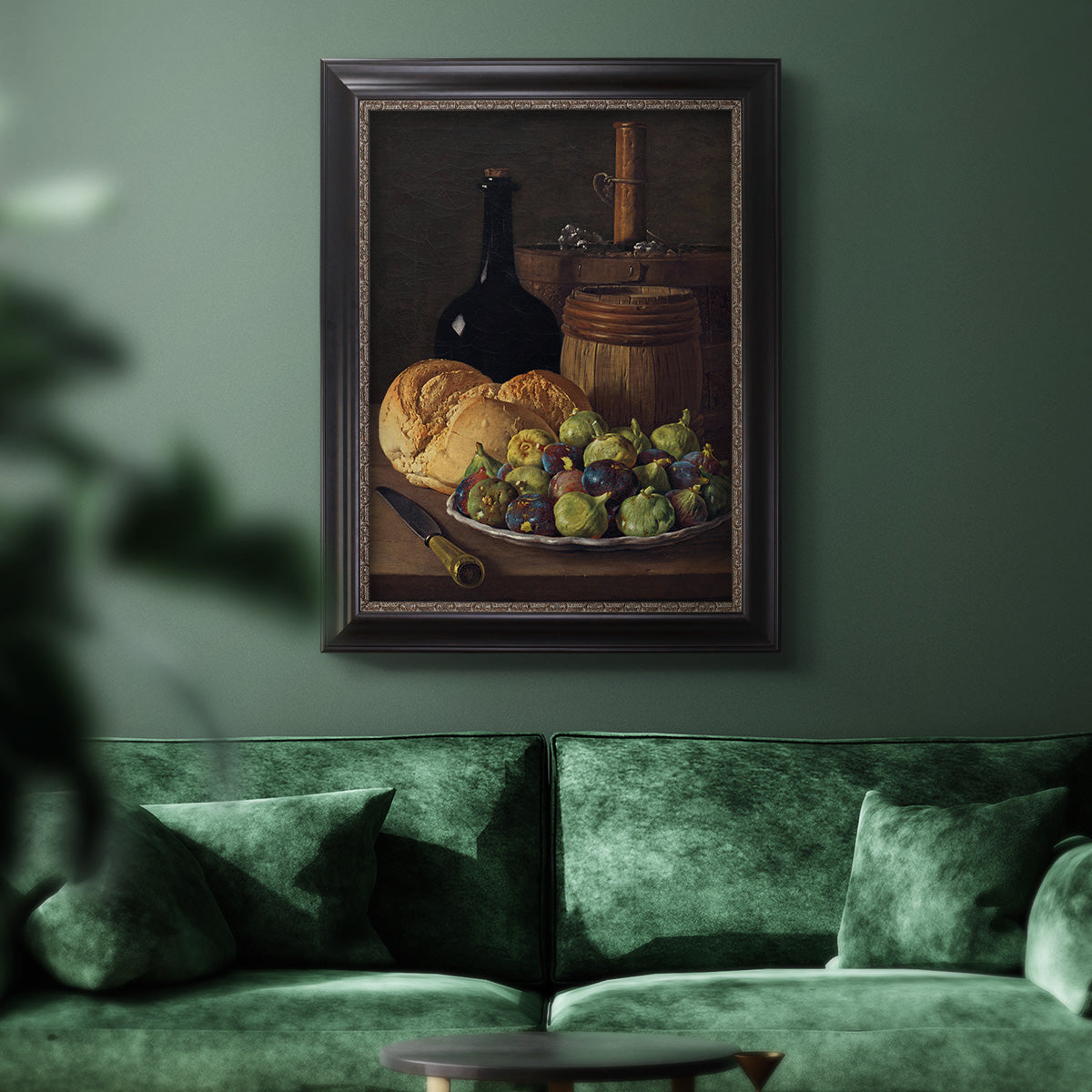 Realist still life with figs and bread by Luis Meléndez in an ornate black frame with gilded inner detail displayed in a dark-toned interior setting.